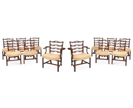 A SET OF TWELVE GEORGE III MAHOGANY LADDER BACK DINING CHAIRSLATE 18TH CENTURY, PROBABLY SCOTTISHComprising a pair of armchai