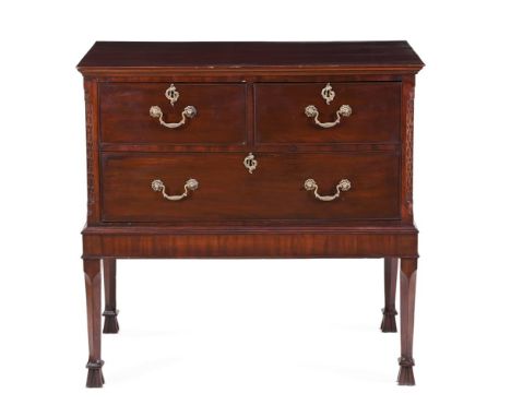 A MAHOGANY COMMODE ON STANDLATE 19TH/ 20TH CENTURYWith rectangular top above two short and one long part ash-lined drawer bet