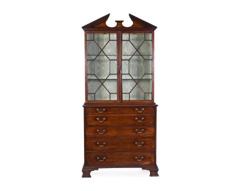 A GEORGE III MAHOGANY SECRETAIRE BOOKCASE IN THE MANNER OF THOMAS CHIPPENDALE, CIRCA 1770 The hinged secretaire drawer openin