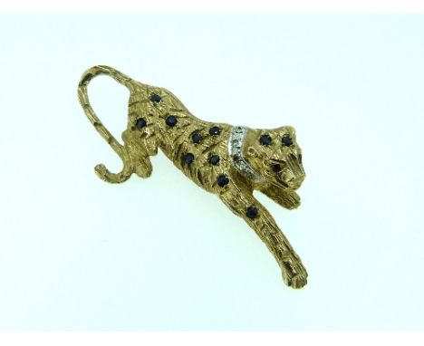 A 9ct yellow gold textured leopard Brooch, set with sapphires, ruby eyes and diamond stud collar.