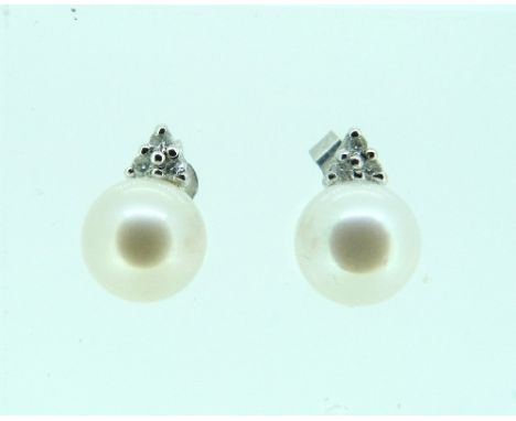 A single row of cultured Pearls, with a 9ct white gold circle and bar clasp, the front of each with small diamond points, tog