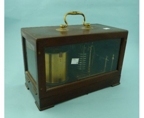 A vintage Barograph, of glazed rectangular form with hinged cover and carry handle, 12½in (31.5cm) long, together with additi