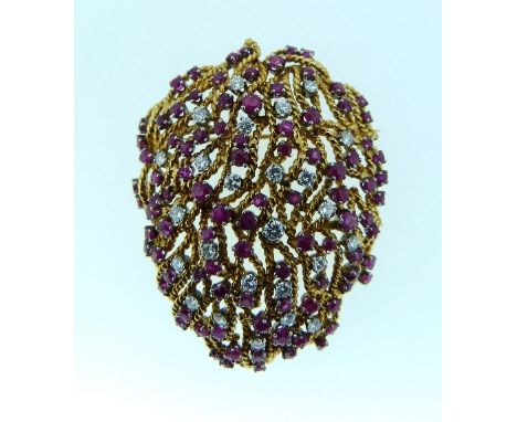 A ruby and diamond Brooch, designed as an abstract waterfall of brilliant cut diamonds and circular cut rubies, all mounted i