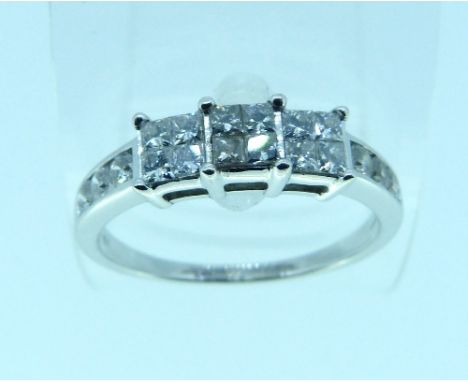 A diamond set Ring, with three centre squares, each set with four small diamonds and with three diamonds on each shoulder, al