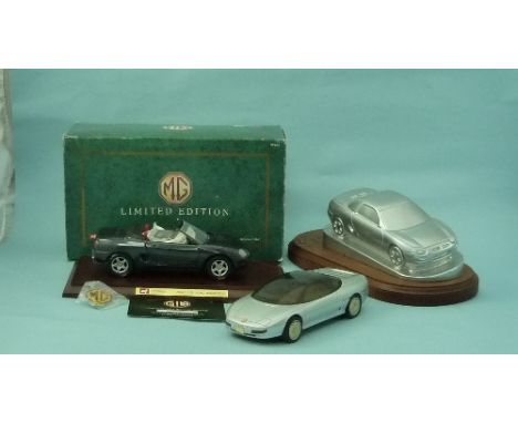 MG interest: a rolling model of the MG EX-E concept car, 8in (20.25cm) long, and a silvered resin desk model of the MGF, on w