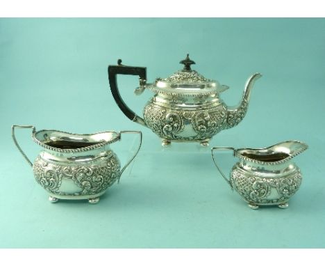 A pretty Victorian silver three-piece Tea Service, by Joseph Gloster, hallmarked Birmingham, 1898, of ovoid form with chased 