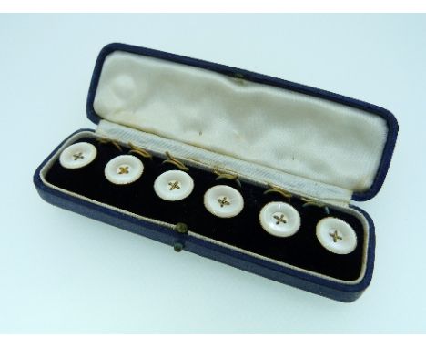 A cased set of six Waistcoat Buttons, in mother of pearl with gold thread crosses, backed in 18ct yellow gold, together with 