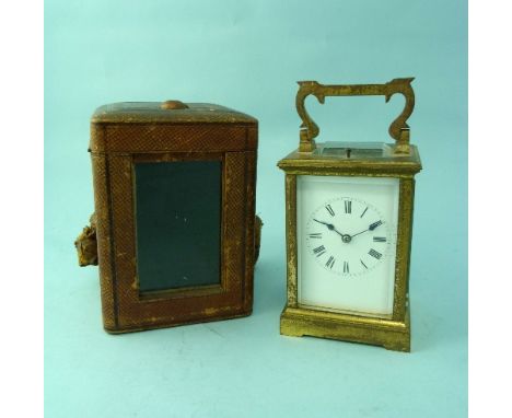 A French gilt brass repeating Carriage Clock, with white enamel dial and black Roman numerals, the twin train movement with l