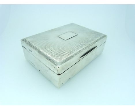 A George V silver Cigarette Box, hallmarked Birmingham, 1913, of hinged rectangular form, the lid with engine turned decorati