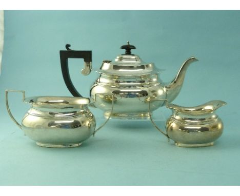 A George V silver three-piece Tea Set, by Marson & Jones, hallmarked Birmingham, 1931, of ovoid form with moulded girdle, com