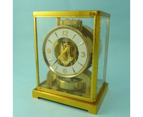 A Jaeger LeCoultre Atmos Clock, number 109904, of five-glass form with gilt brass case and hinged front door, the 4¼in open c