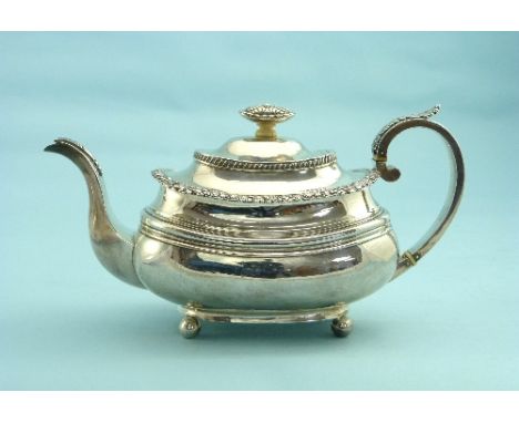 A George IV silver Teapot, by Simon Levy, hallmarked, Exeter, 1823, of ovoid form, with reeded girdle, and ball feet, decorat