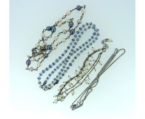 A cultured pearl Necklace, with facetted blue stones between, together with a necklace of grey and white cultured pearls with