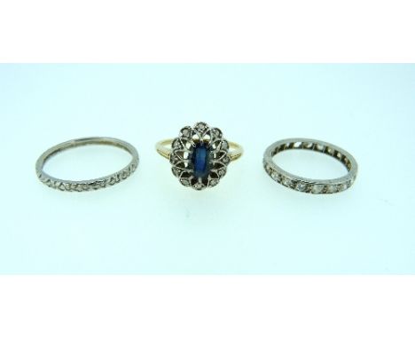 An oval sapphire and diamond Ring, mounted in yellow gold, Size N, together with a platinum wedding band, Size O, and a diamo