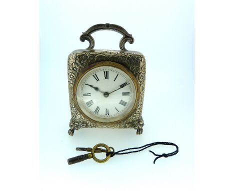 A Victorian silver Carriage Timepiece, hallmarked Birmingham, 1898, of squared form with carry handle and chased foliate deco