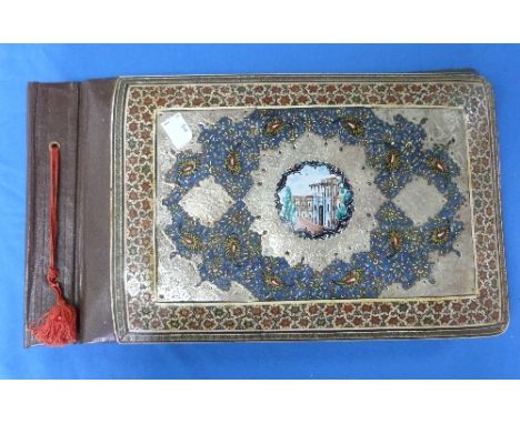 An early 20thC Persian Album Folder, decorated with an applied enamel centre medallion of a building, inlaid mosaic border, s