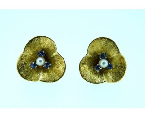 A pair of textured yellow gold trefoil leaf Earrings, each centre set cultured pearl and three small sapphires, marked 750. 