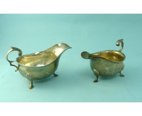 A pair of George V silver Sauce Boats, by Harrison Brothers & Howson, hallmarked Sheffield, 1930 and 1935, each of ovoid form