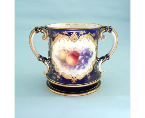 A Royal Worcester porcelain Loving Cup, painted with fruit by R. Sebright, in a shaped cartouche on a blue ground, printed ma