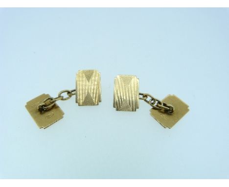 A pair of 9ct yellow gold double ended Cufflinks, with chain between, each side with engine turned decoration, 5.8g (2)