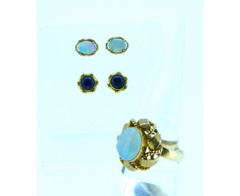 An oval opal Dress Ring, mounted in 14k rose gold, together with a pair of small oval opal ear studs mounted in yellow metal 