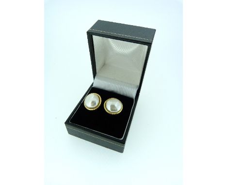 A pair of baroque cultured pearl Ear studs, mounted in 18ct yellow gold.