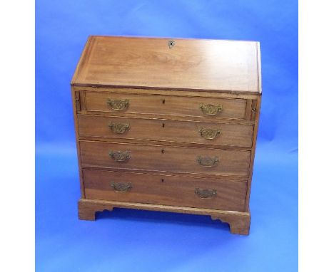 A Georgian mahogany Bureau, the fall front enclosing a fitted interior, above four long graduated drawers, on bracket feet, 3