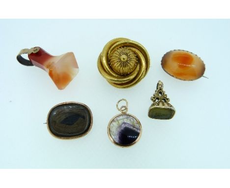 A shaped square agate Seal, with gilt metal finial, a small yellow metal seal set green stone, an agate brooch, two mourning 