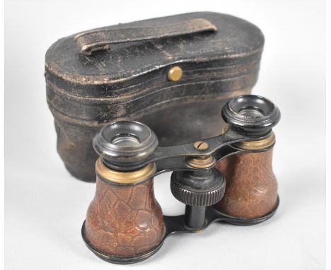 A Vintage Cased Pair of Leather Mounted Opera Glasses 
