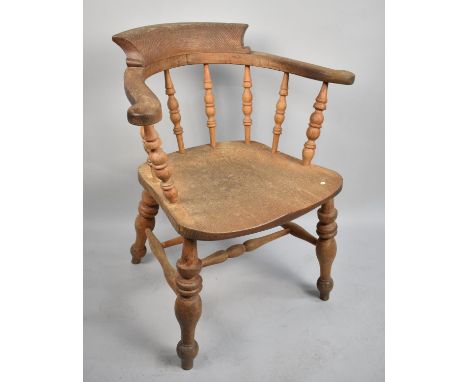 A Vintage Spindle Backed Smokers Bow Armchair 