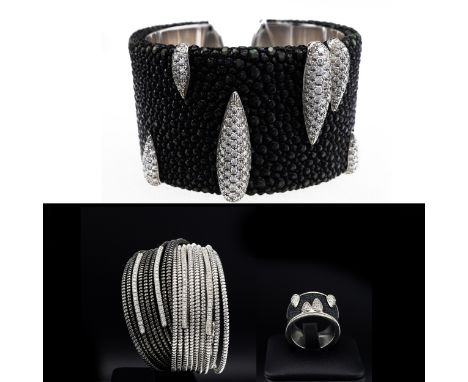 AN 18CT WHITE GOLD SHAGREEN AND DIAMOND ENCRUSTED CUFF BANGLE, with torpedo shaped motifs encrusted with graduated diamonds, 