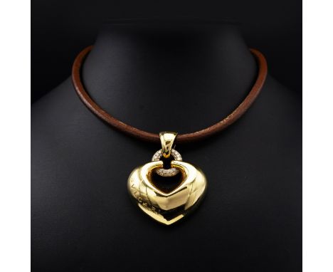AN ITALIAN BVLGARI 18CT YELLOW GOLD AND DIAMOND SET PENDANT NECKLACE, the pendant in the form of a heart with a diamond encru
