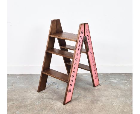 STEP LADDER, folding with various champagne house names down sides, 63.5cm x 44cm x 80.5cm.