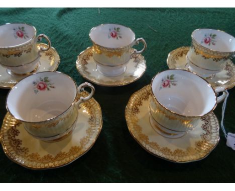 Five Elizabethan pattern fine bone china teacups & saucers, having hand painted floral decoration with gilt finish.