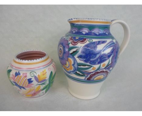 A Poole Pottery tall jug with handle in the Bluebird pattern, designed by Truda Carter (21cm tall), impressed marks to base w