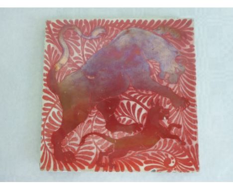 A William de Morgan ruby lustre tile, featuring a lioness and cub before a foliate design, probably Chelsea period, on an unm