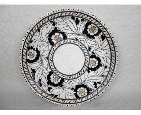 A 1930s Crown Ducal wall plaque, designed by Charlotte Rhead in the Tudor Rose pattern, no. 5293, (a variation of 4040 Persia