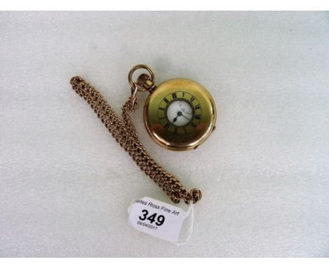 An Edwardian half-hunting cased keyless lever watch, together with a 9ct gold watch chain, the watch with enamelled Roman num