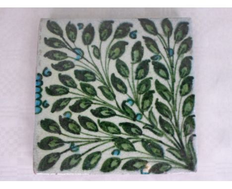 A William de Morgan Oblique Leaf tile, painted in shades of green and blue, impressed Merton Abbey stamped to reverse (6 inch