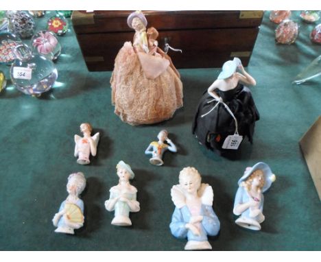 A collection of 8 Continental ceramic pin cushion dolls, two with original cushions.