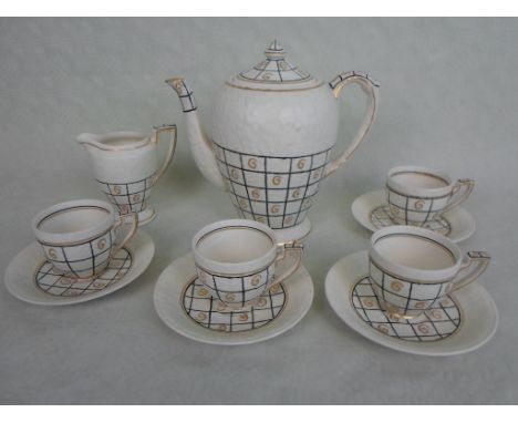 A 1930s Crown Ducal part-coffee service designed by Charlotte Rhead, pattern no. 4956, comprising: coffee pot, milk jug and f