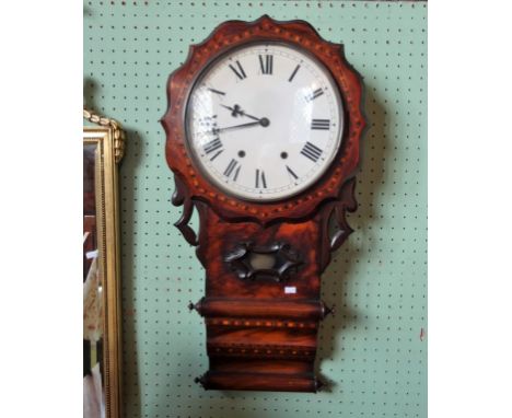 An American wall clock, the circular enamel dial bearing Roman numerals (77cm).