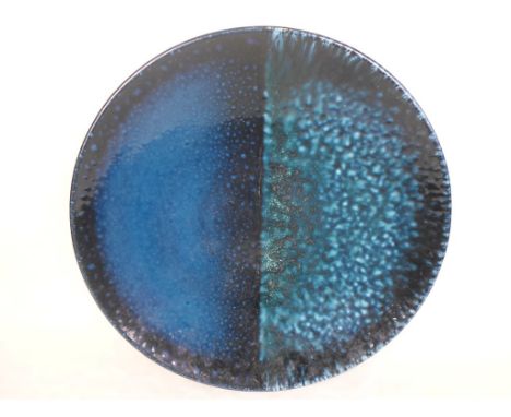 A Poole Pottery limited edition Phases of the Moon pattern charger, signed by Alan Clarke and numbered 865/1000 (40cm diamete