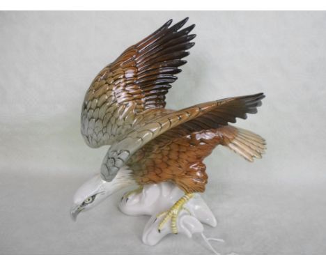A Karl Ens ceramic model of an eagle, blue printed mark to base (25cm tall).