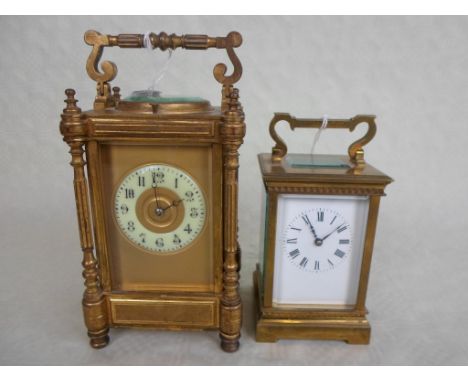 A French gilt brass carriage clock, having five panelled bevelled edge glass, the repeating coil gong striking movement, the 