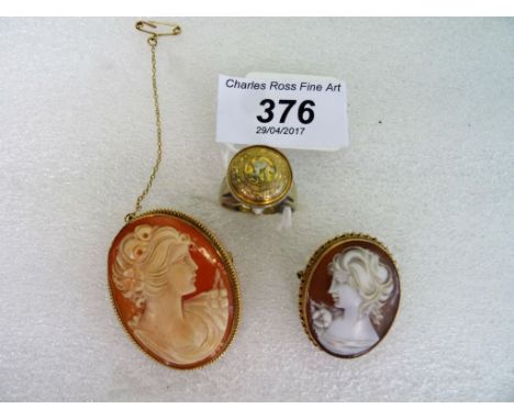 A 9ct gold mounted shell cameo of a lady, together with another, similar and a ring.