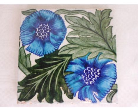 A William de Morgan K L Rose pattern tile, painted in shades of blue and green on an off-white ground, Sands End Pottery mark