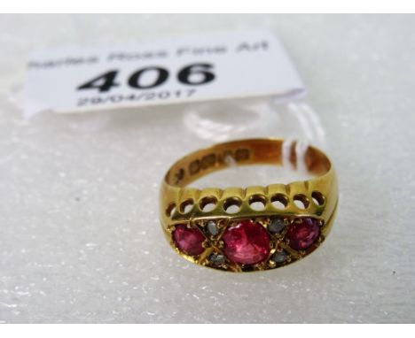 A seven stone ruby and diamond half-hoop ring, the graduated mixed old cut stones in carved and pierced mount.