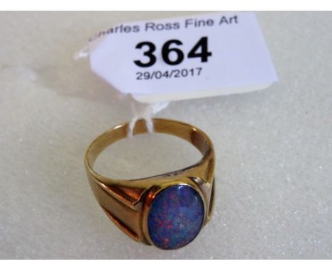 A gentleman's 9ct gold signet ring, set with oval cut opal.   Condition Report:  Circa 24mm interior diameter.