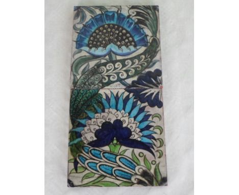Two William de Morgan tiles of Islamic inspired design, featuring flowers and leaves painted in shades of blue and green, eac